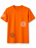 Front view of an oversized orange cotton T-shirt with white mandala graphic on the chest, black mandala print near the hem, and matching sleeve print.