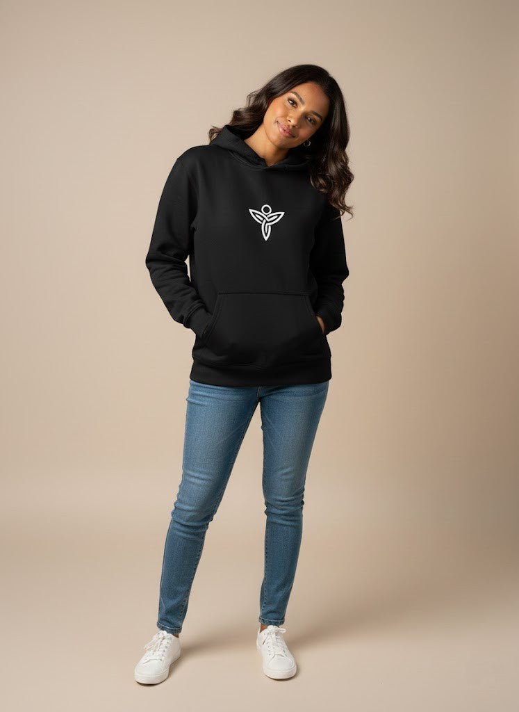Woman wearing a black Sabio hoodie with a logo and blue jeans