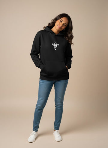 Woman wearing a black Sabio hoodie with a logo and blue jeans