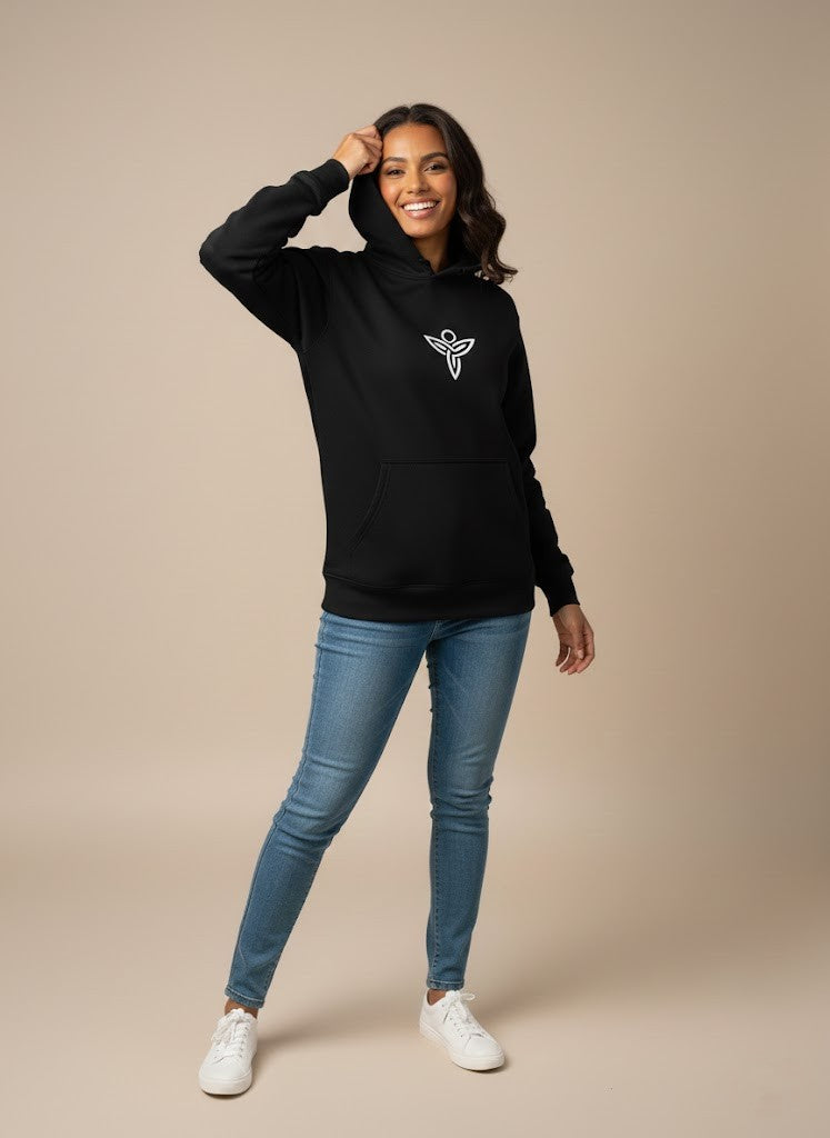 Woman wearing a black Sabio hoodie with a logo and blue jeans
