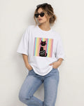 Casual styling of unisex white oversized cat graphic tee with hands in pockets.
