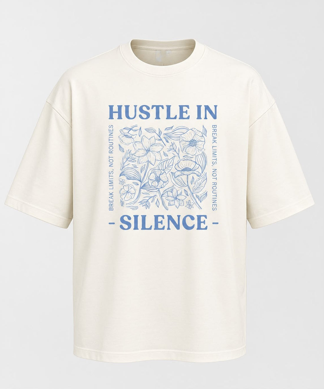 Front product flat view of an off-white oversized crewneck t-shirt featuring a blue floral sketch graphic and "Hustle In Silence" lettering centered on the chest.