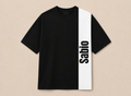 A black short-sleeve t-shirt with a bold white vertical stripe on the right side featuring the word 'Sabio' in black text, displayed flat against a light beige background.