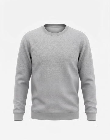 Front view of male model wearing The Sabio oversized heather grey fleece sweatshirt paired with light wash denim.