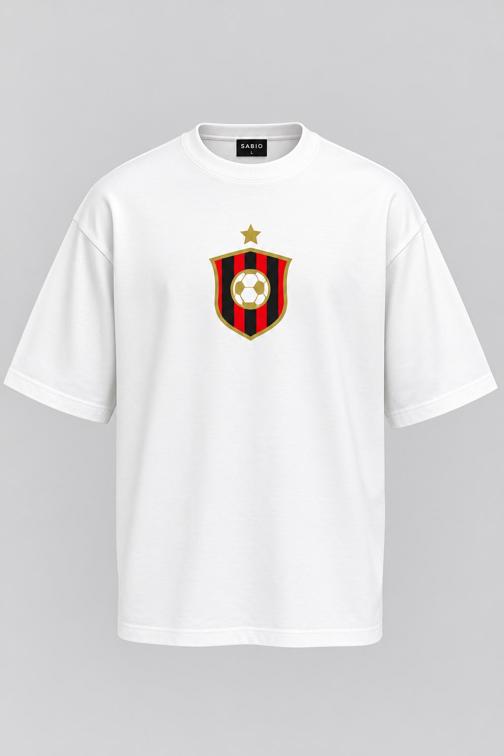 A white short-sleeve crewneck t-shirt featuring a red and black striped shield crest with a gold star and soccer ball on the chest, displayed on a neutral gray background.