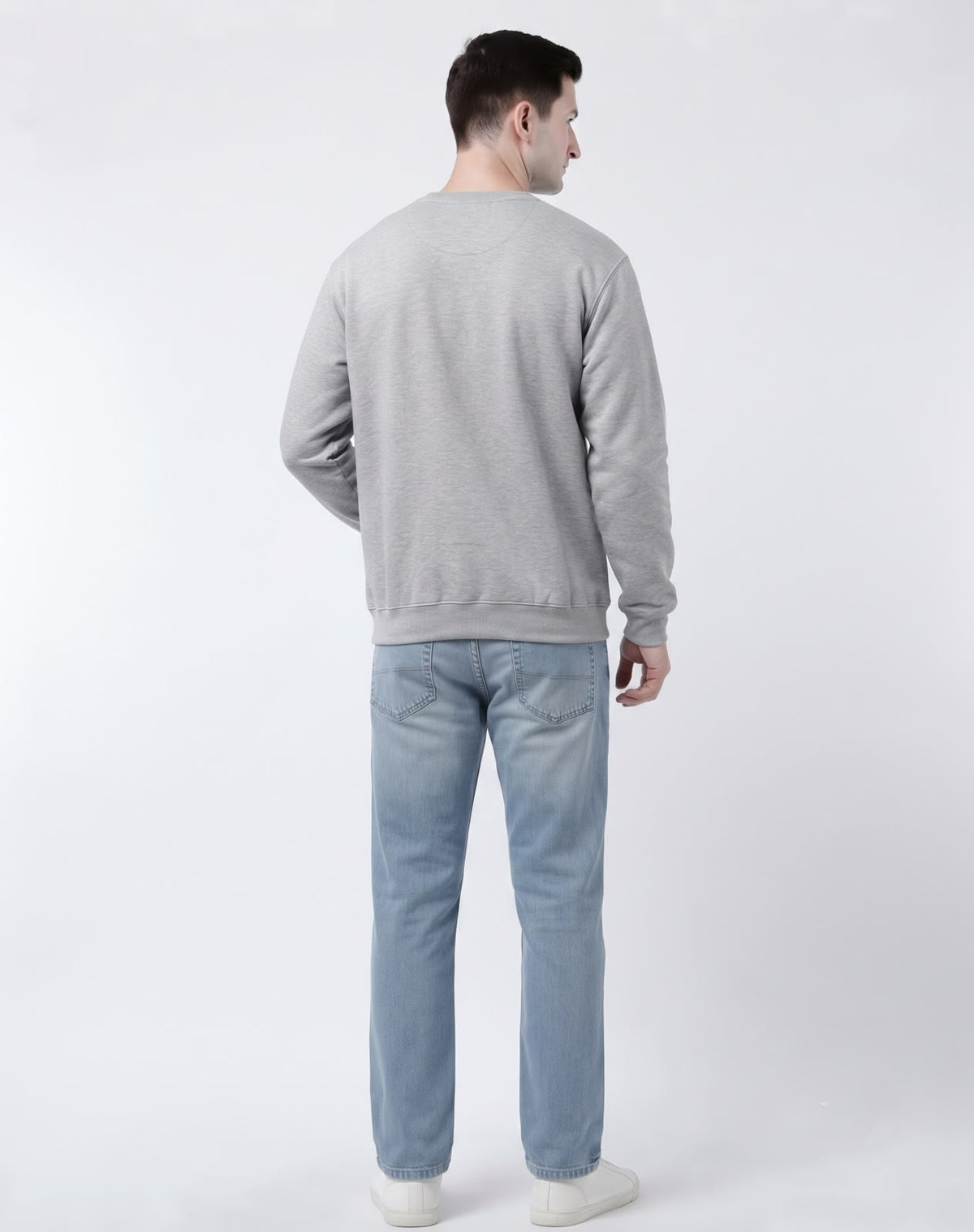 Side three-quarter angle of model styled in The Sabio drop-shoulder heather grey fleece sweatshirt.