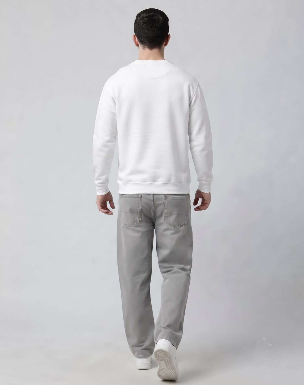 Full length back profile of male model wearing The Sabio structured white pullover sweatshirt.